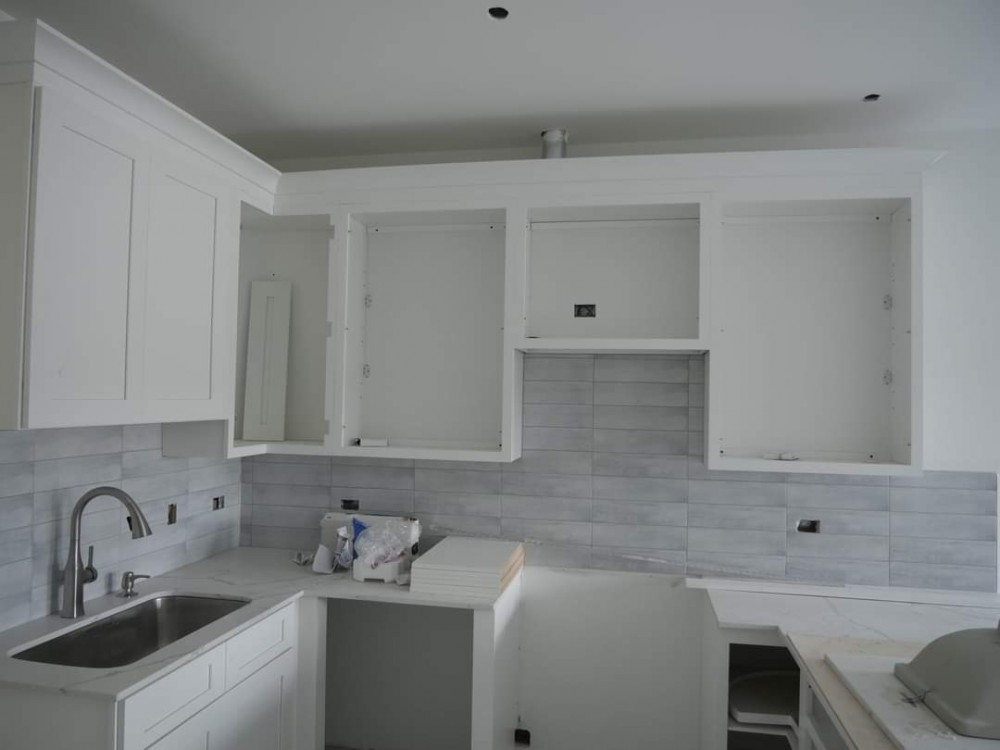(E) 1 Bedroom Condo - Interior with quartz countertops and subway tile kitchen backsplash in light grey